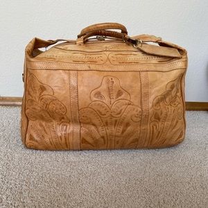 Vintage leather duffel bag.